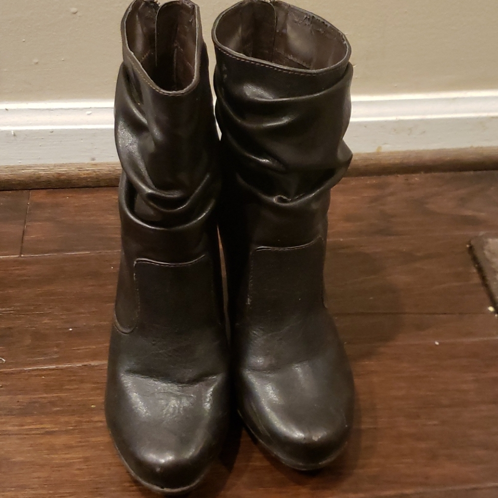 Dark brown heeled bootie with zipper.